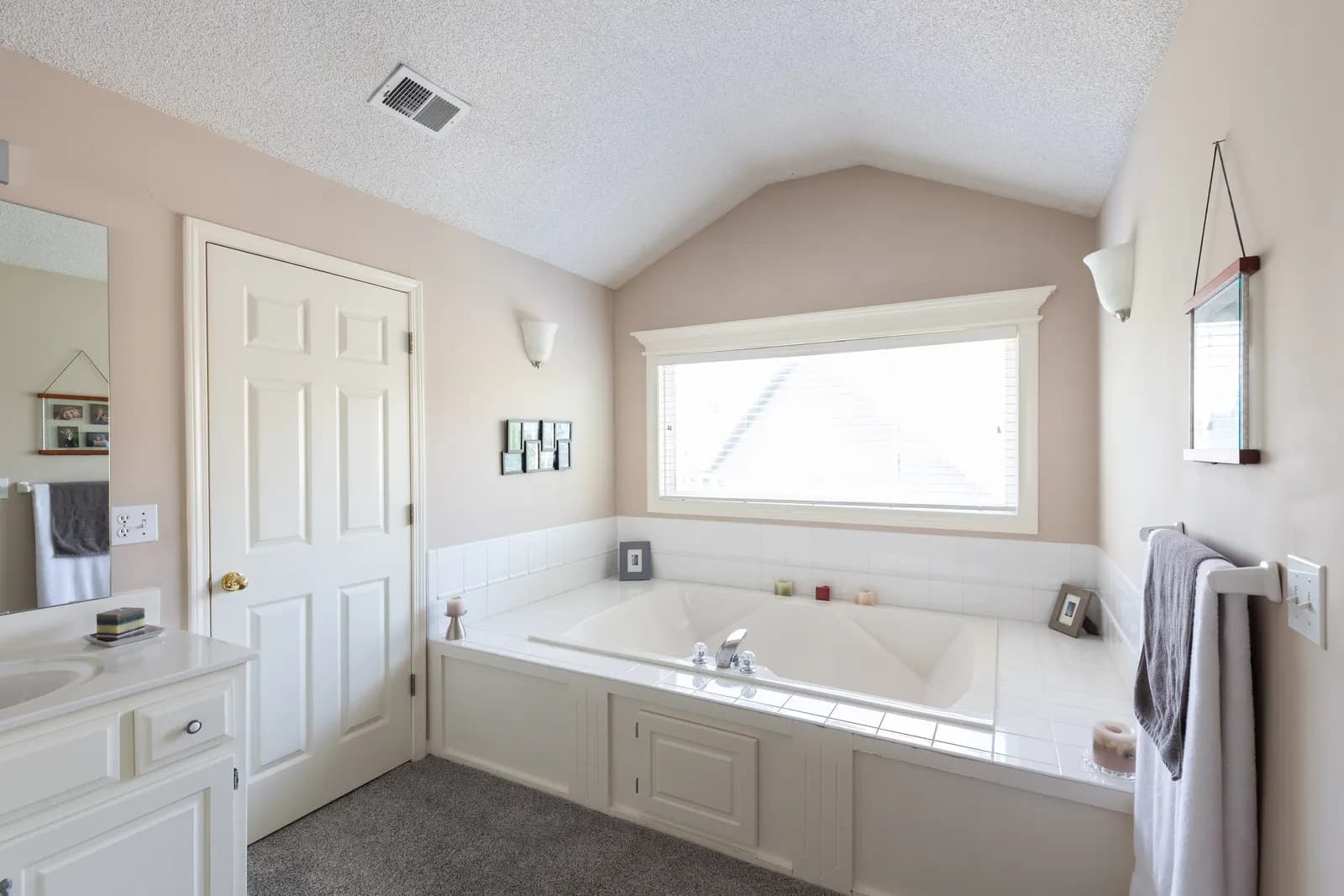 White kitchen with an island and wood floors, Kansas City listing