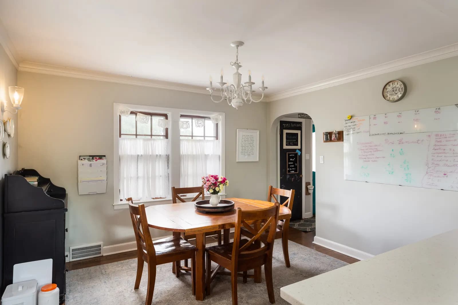Bright white kitchen with wood floors, Kansas City listing